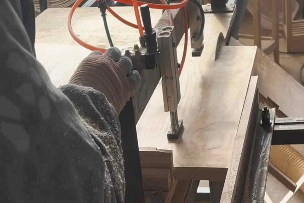 Cutting wooden panels at Hilon custom wood products manufacturing facility
